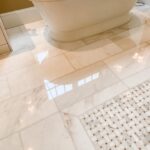 a white bathtub on a marble floor